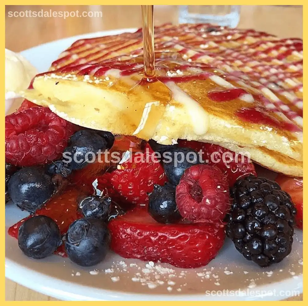 Fluffy red velvet pancakes with cream cheese frosting at Butters kid-friendly breakfast restaurant North Scottsdale