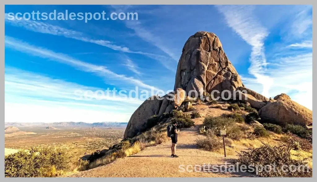 Tom's Thumb Trail hiker North Scottsdale iconic granite boulder formation McDowell Sonoran Preserve summit Arizona