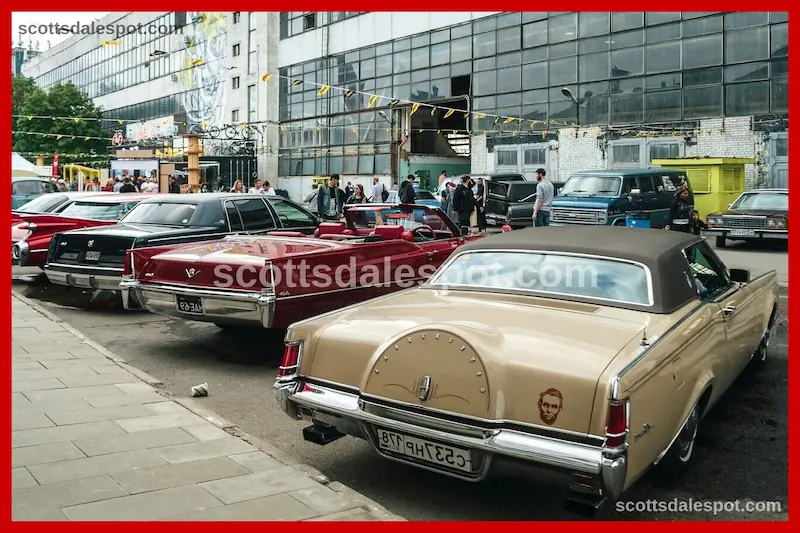 view of large car event venue with hundreds of classic vehicles