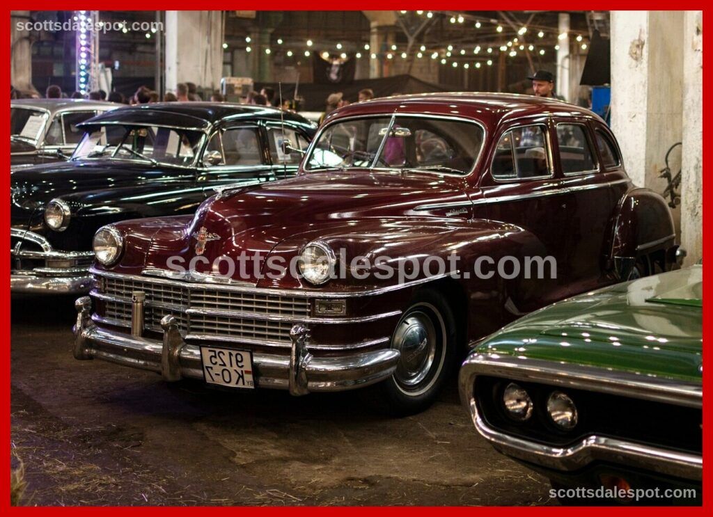 Vintage automotive memorabilia including gas pumps and neon signs