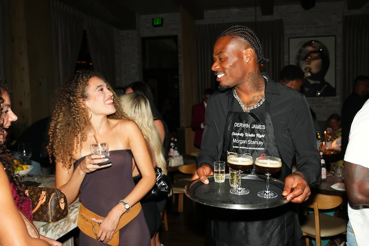 NFL player serving cocktails inside The Guest House Scottsdale during Celebrity Waiter Night